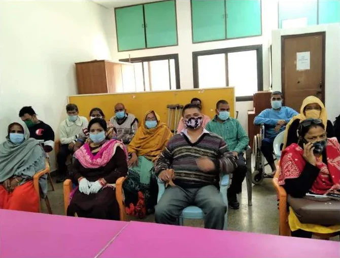 Parents seated in rows at a workshop